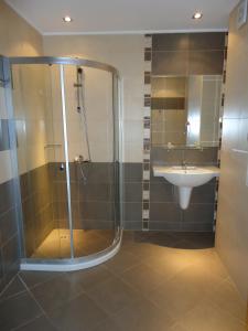 a bathroom with a shower and a sink at Tropics Hotel - Ultra All Inclusive in Sveti Vlas