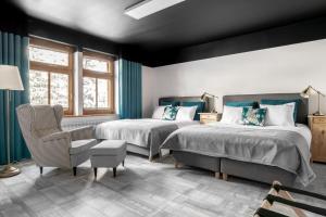 Postel nebo postele na pokoji v ubytování APARTAMENTY DVOOR1924