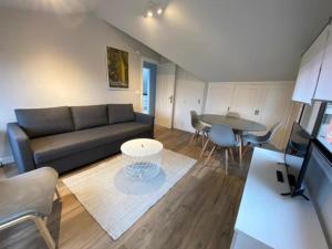 a living room with a couch and a table at Housingcoruña playa miño 5 in Miño