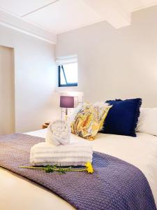 Llit o llits en una habitació de Urban Pod in Vibrant Green Point