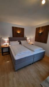 Кровать или кровати в номере Isartaler Hoamat Haus