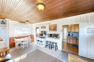 a kitchen with a table and a dining room at Cottage by the Sea (MCA #1213) in Manzanita