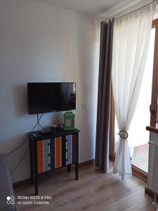 TV a/nebo společenská místnost v ubytování Vlašićka idila apartman Eko Fis 507