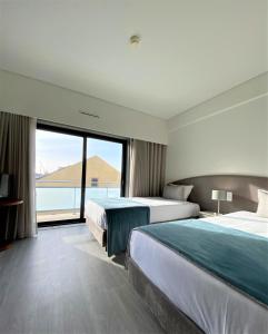 Postel nebo postele na pokoji v ubytování Apulia Praia Hotel + 37 fotografií