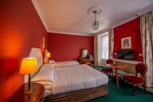 Krevet ili kreveti u jedinici u okviru objekta Foyles Hotel