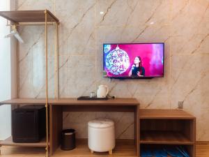 Een TV en/of entertainmentcenter bij Swan Hotel
