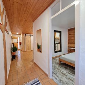 a hallway with a bedroom and a bed at Casas Alba Odeceixe in Odeceixe