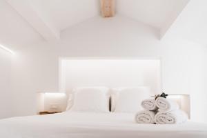 Säng eller sängar i ett rum på La Casita del Pescador