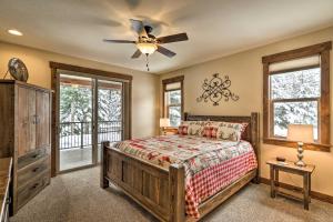 a bedroom with a bed and a ceiling fan at Bigfork Modern Living - Pet and Family Friendly! in Bigfork