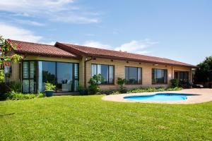 a house with a pool in the yard at Sea Forever in Pennington