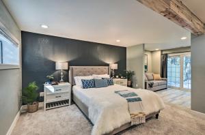 a bedroom with a large bed and a couch at Hot Tub, Fire Pit and Grill Oasis in Flagstaff! in Mountainaire