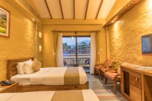 Ένα ή περισσότερα κρεβάτια σε δωμάτιο στο Bar Peepal Resort