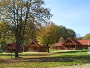 a large building with trees in front of it at Ferienpark Arber in Zwiesel