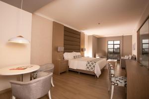 Ένα ή περισσότερα κρεβάτια σε δωμάτιο στο Hotel Dann Carlton Medellín