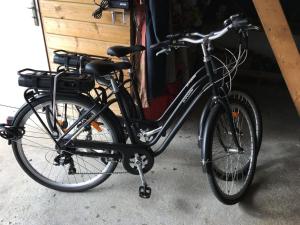 a black bike parked next to a garage at Villa spacieuse à Bidart avec piscine privée 330 m² in Bidart