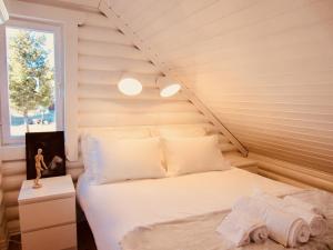 Ένα ή περισσότερα κρεβάτια σε δωμάτιο στο Mountain Chalet