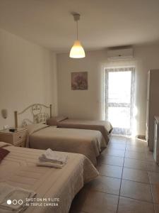 Postel nebo postele na pokoji v ubytování Villa Lorenza