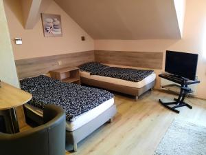 Postel nebo postele na pokoji v ubytování Penzion Avena