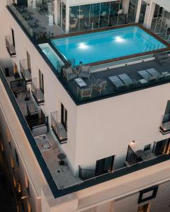 an overhead view of a swimming pool on a building at The Embassy Valletta Hotel in Valletta