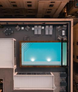 an overhead view of a swimming pool on a building at The Embassy Valletta Hotel in Valletta