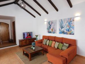 a living room with a couch and a table at Casa La Florida in Tuineje
