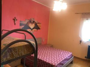 Кровать или кровати в номере Vacanze da Emanuele