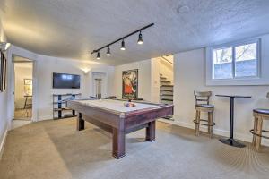 a living room with a pool table in it at Boise Tudor Home with Game Room Less Than 2 Mi to Downtown! in Boise