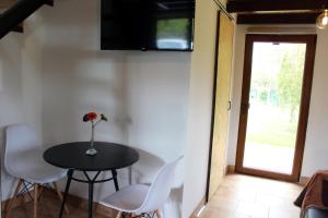 A television and/or entertainment centre at El llagar - Sagasta Rural Oviedo