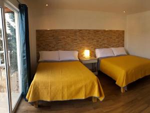 Postel nebo postele na pokoji v ubytování HOTEL COLIBRÍ