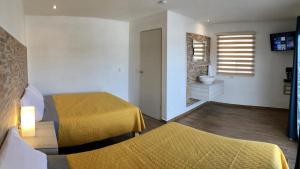 Postel nebo postele na pokoji v ubytování HOTEL COLIBRÍ