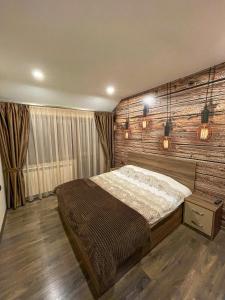 מיטה או מיטות בחדר ב-Къща за гости Амая - Сандански