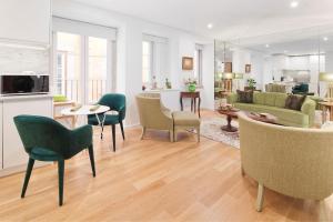 a living room filled with furniture and a tv at Lisbon Rentals Chiado in Lisbon
