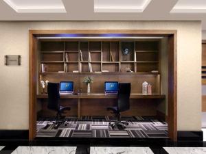 an office with two computers on a desk at Surmeli Istanbul Hotel in Istanbul