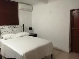 A bed or beds in a room at MI CA-SA EN MÉRIDA