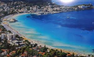 an aerial view of a beach in a city at casaLiuccia in Mondello