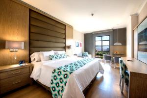 Ένα ή περισσότερα κρεβάτια σε δωμάτιο στο Hotel Dann Carlton Medellín