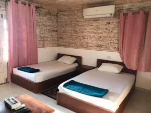 A bed or beds in a room at Station House