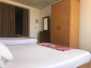 A bed or beds in a room at Station House