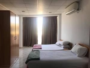 A bed or beds in a room at Station House