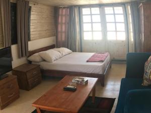 A bed or beds in a room at Station House