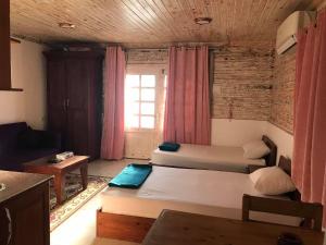 A bed or beds in a room at Station House