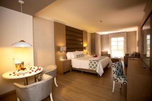 Ένα ή περισσότερα κρεβάτια σε δωμάτιο στο Hotel Dann Carlton Medellín