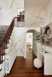 a staircase leading up to a living room at Kennebunkport Captains Collection in Kennebunkport