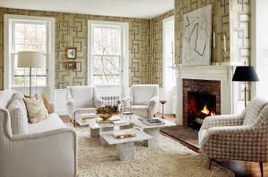 a living room with couches and a fireplace at Kennebunkport Captains Collection in Kennebunkport
