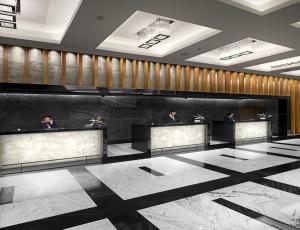 a lobby with people sitting at reception desks at Surmeli Istanbul Hotel in Istanbul