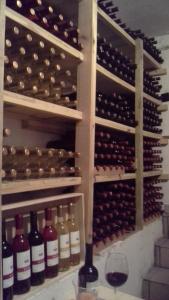 a wine cellar with a bunch of bottles of wine at Agroturystyka Willa Ola in Giewartów