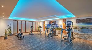 a gym with several exercise bikes in a room at Radisson Blu Hotel Bremen in Bremen