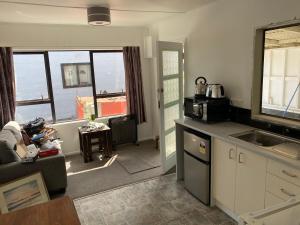 a kitchen with a sink and a counter top at Windsor Motel in Taupo