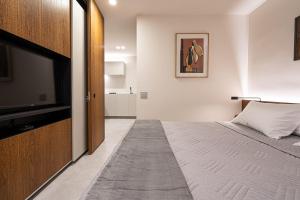Cama o camas de una habitación en Excelente Flat no Itaim II