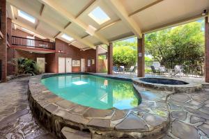 a swimming pool in a house with a patio at Comfort Inn & Suites Sombrero in Adelaide